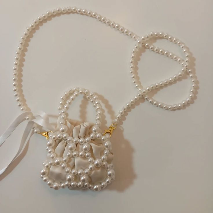 Mini Pearl Cage Drawstring Crossbody Bag